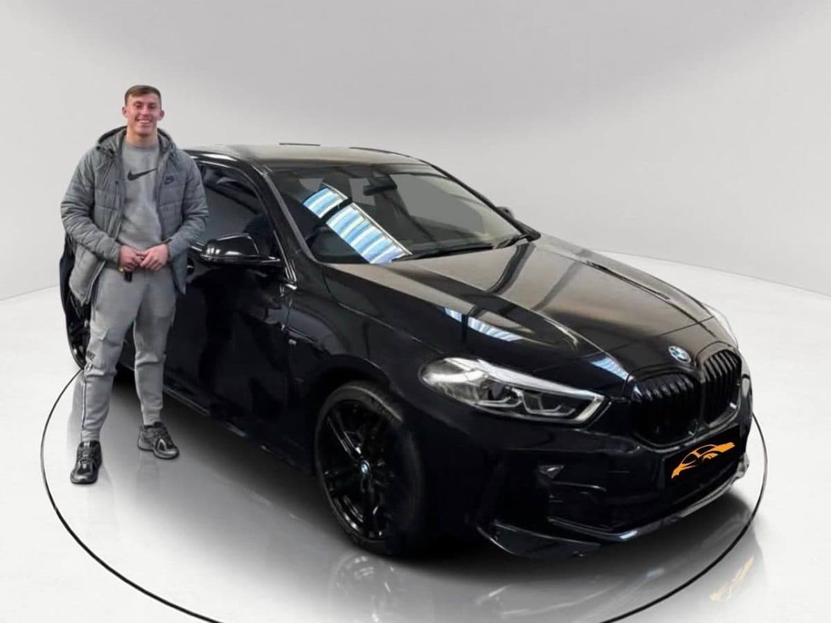 Rapid customer collecting a black BMW 1 Series M Sport