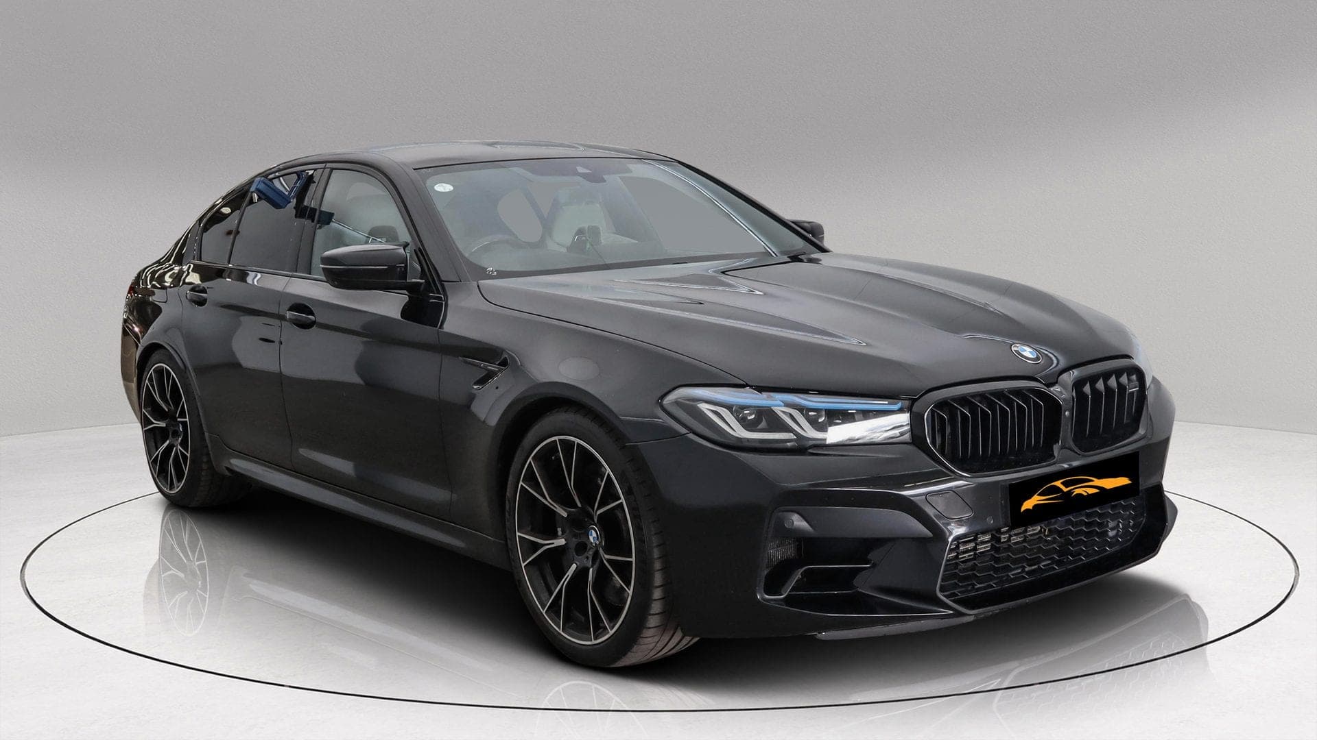 BMW M5 Competition xDrive in black, front three-quarter view