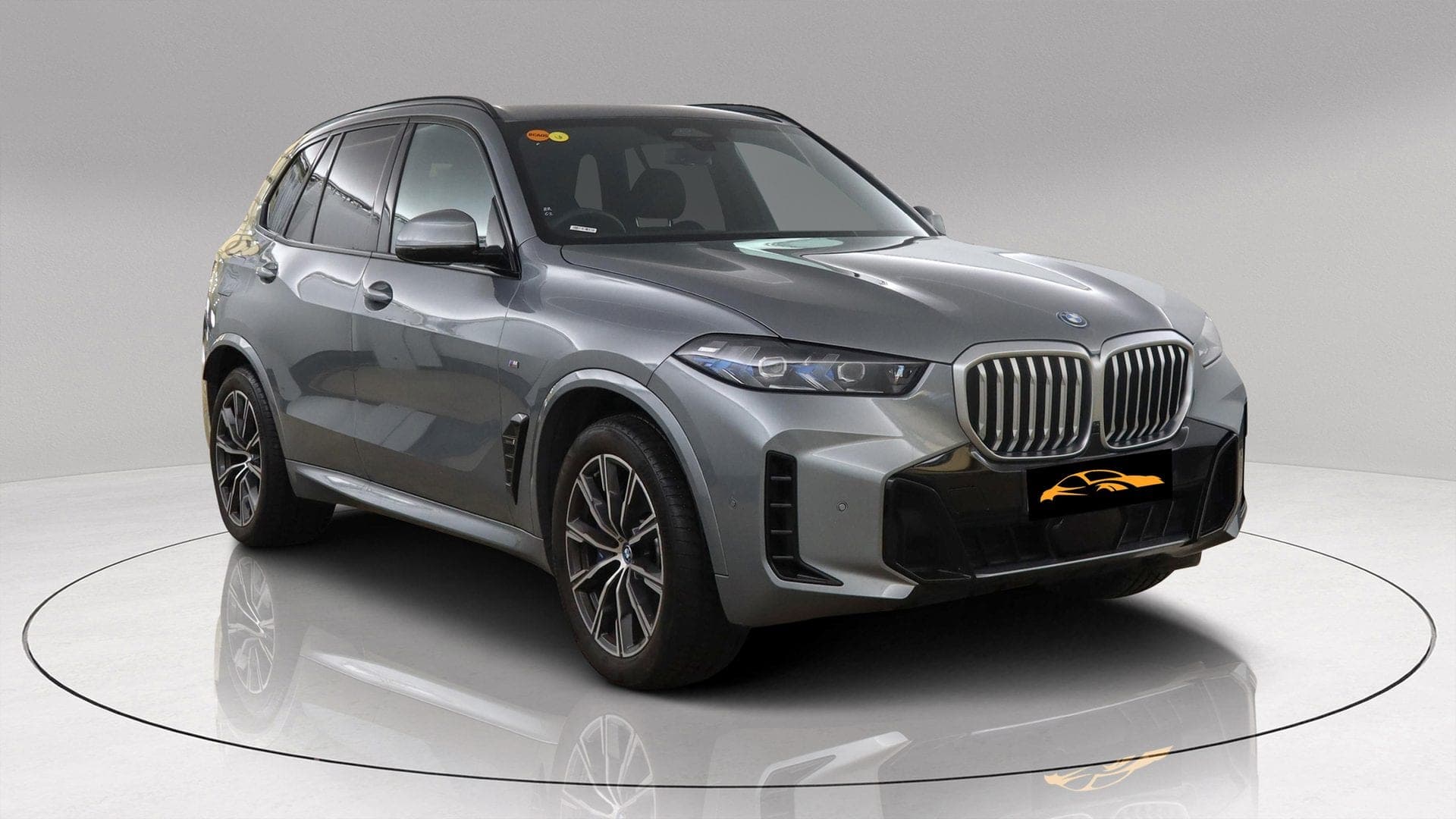 BMW X5 xDrive50e M Sport in grey, front three-quarter view